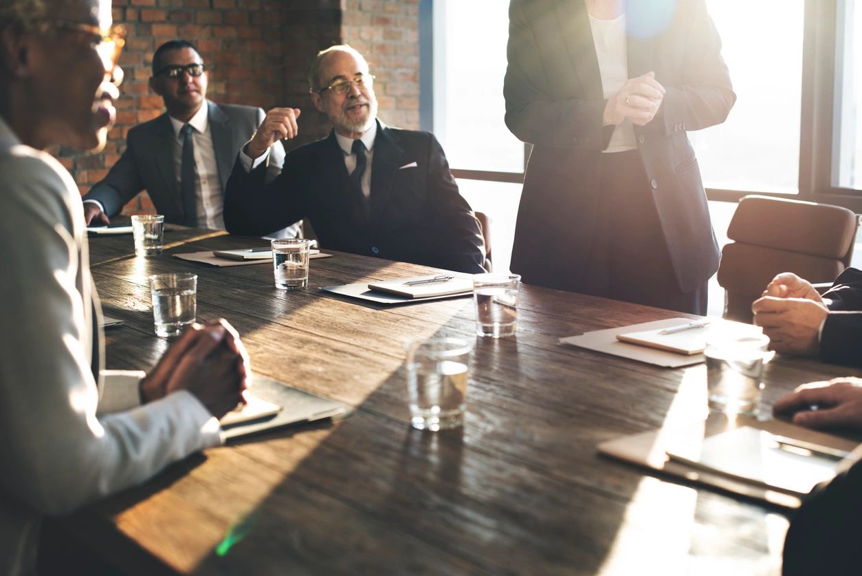 A group of people sitting at a table.